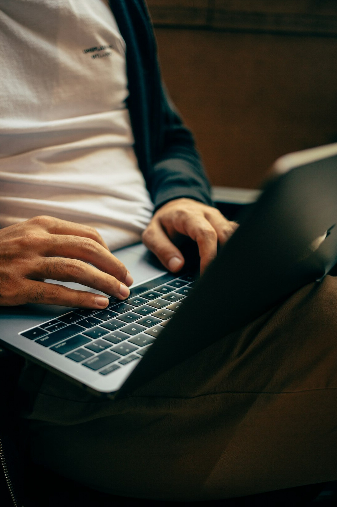 person using social media on laptop