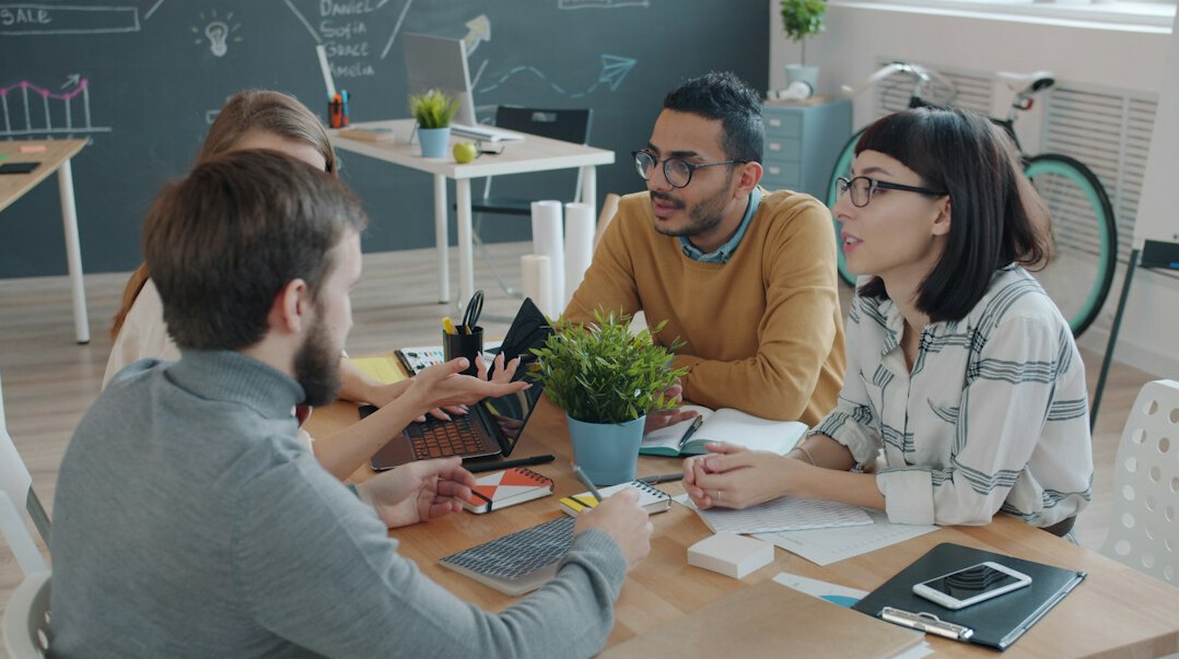people discussing technology in meeting